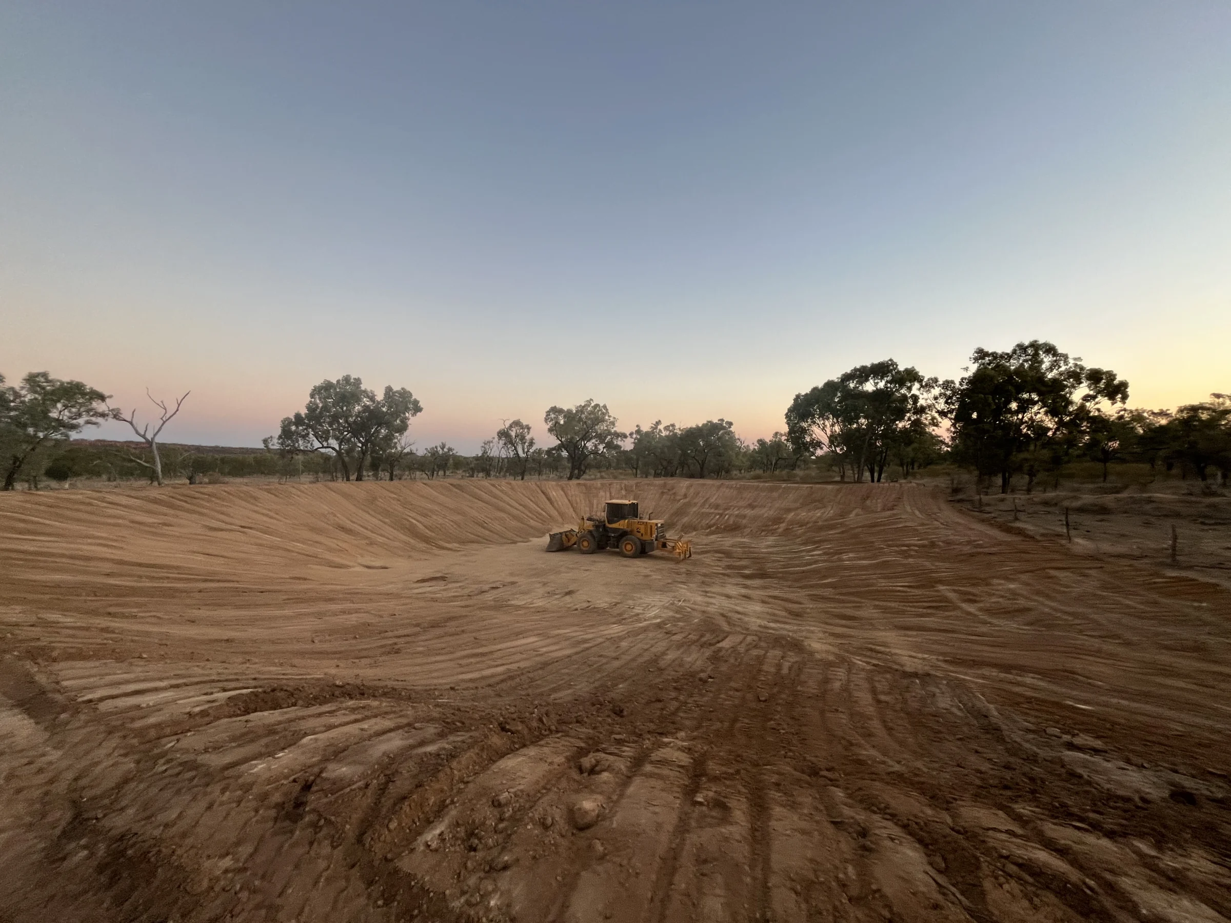 Hunt Earthmoving Contractors grader working on a Central Queensland outback road